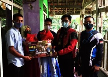 Komunitas Honda BeAT Jakarta Salurkan Bantuan