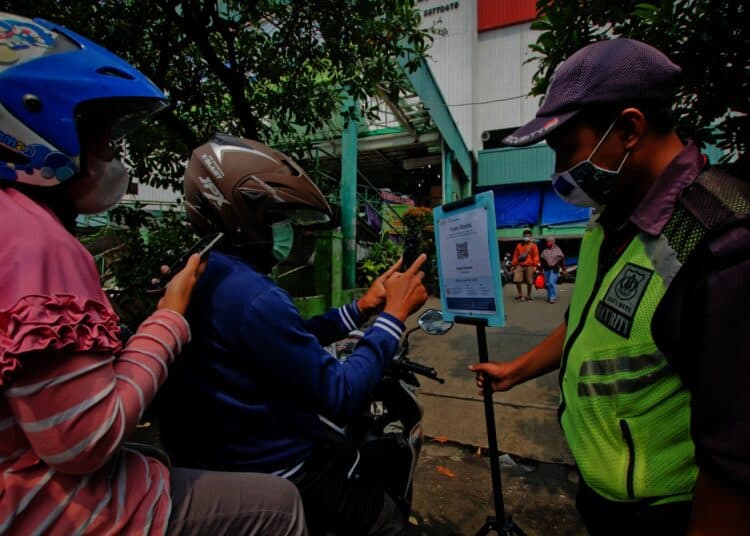 Potret Penerapan Aplikasi PeduliLindungi di Pasar Tradisional